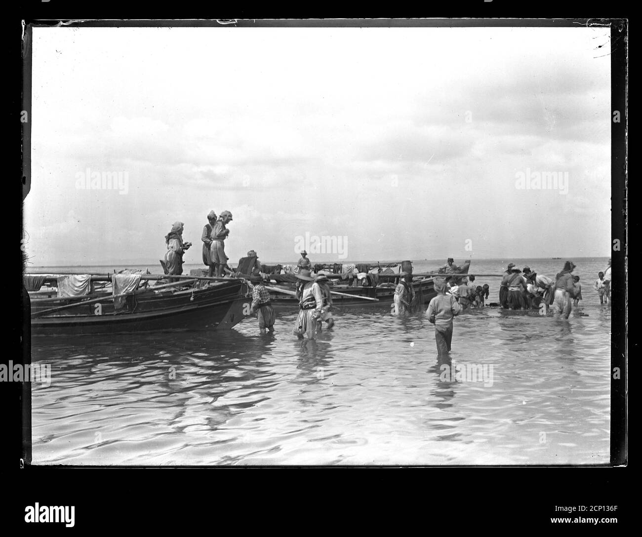 Turkish fishermen maintaining their equiment for the next fishing trip. Turkey, presumably near Izmir (Smyrna). Photograph on dry glass plate from the Herry W. Schaefer collection, around 1913. Stock Photo