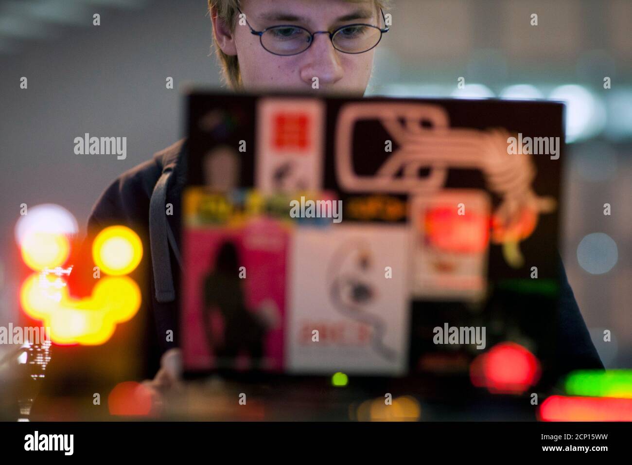 A man uses a computer during the 27th Chaos Communication Congress (27C3) in Berlin, December 27, 2010. The annual four-day conference, organized by the Chaos Computer Club (CCC), offers lectures and workshops and attracts an international audience of hackers, scientists, artists, and utopians.  REUTERS/Thomas Peter (GERMANY - Tags: SCI TECH SOCIETY) Stock Photo