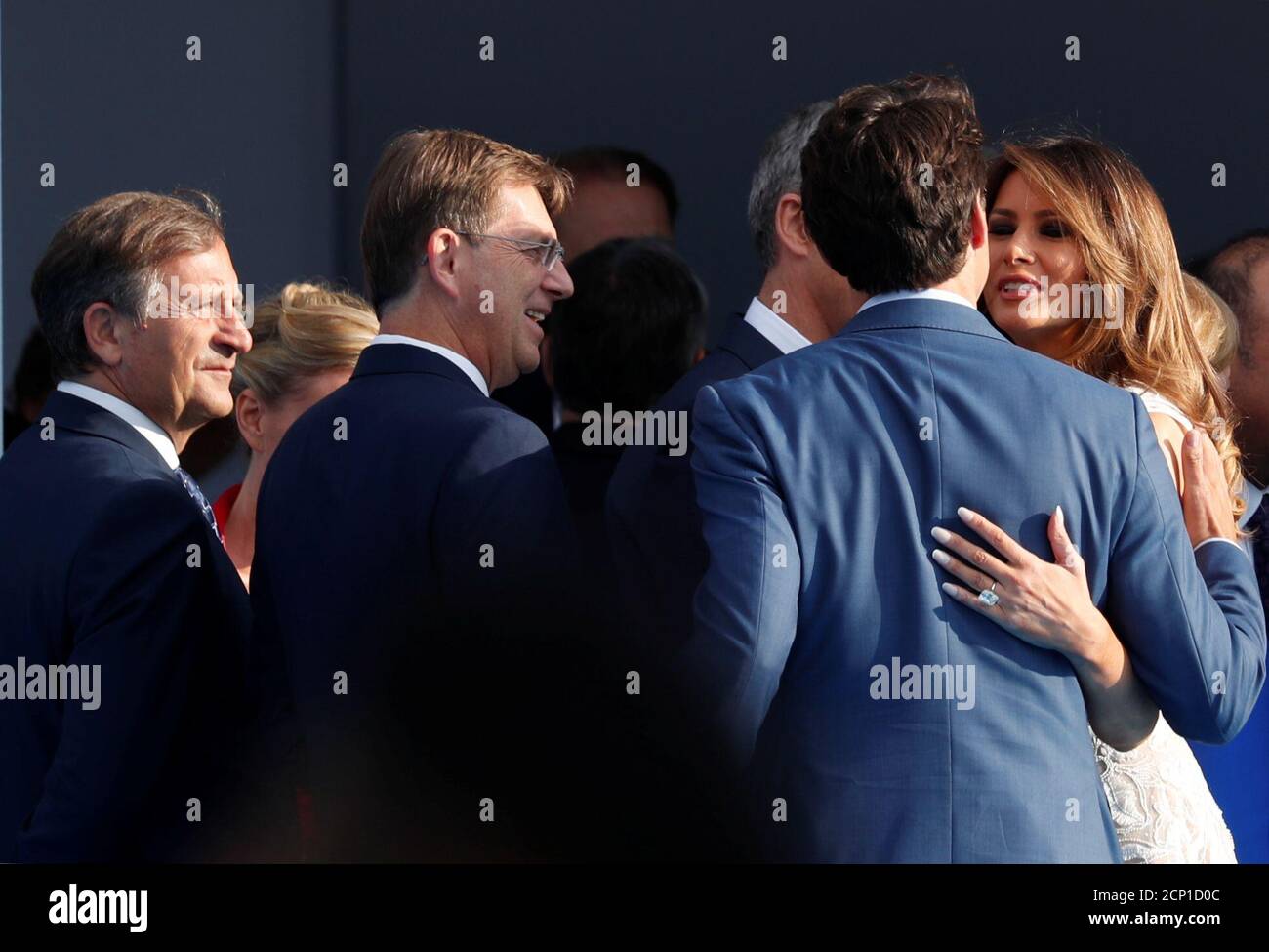 First lady Melania Trump kisses Canada's Prime Minister Justin Trudeau as  Slovenia's Prime Minister Miro Cerar and Slovenia's Foreign Minister Karl  Erjavec look on at the Park of the Cinquantenaire during the