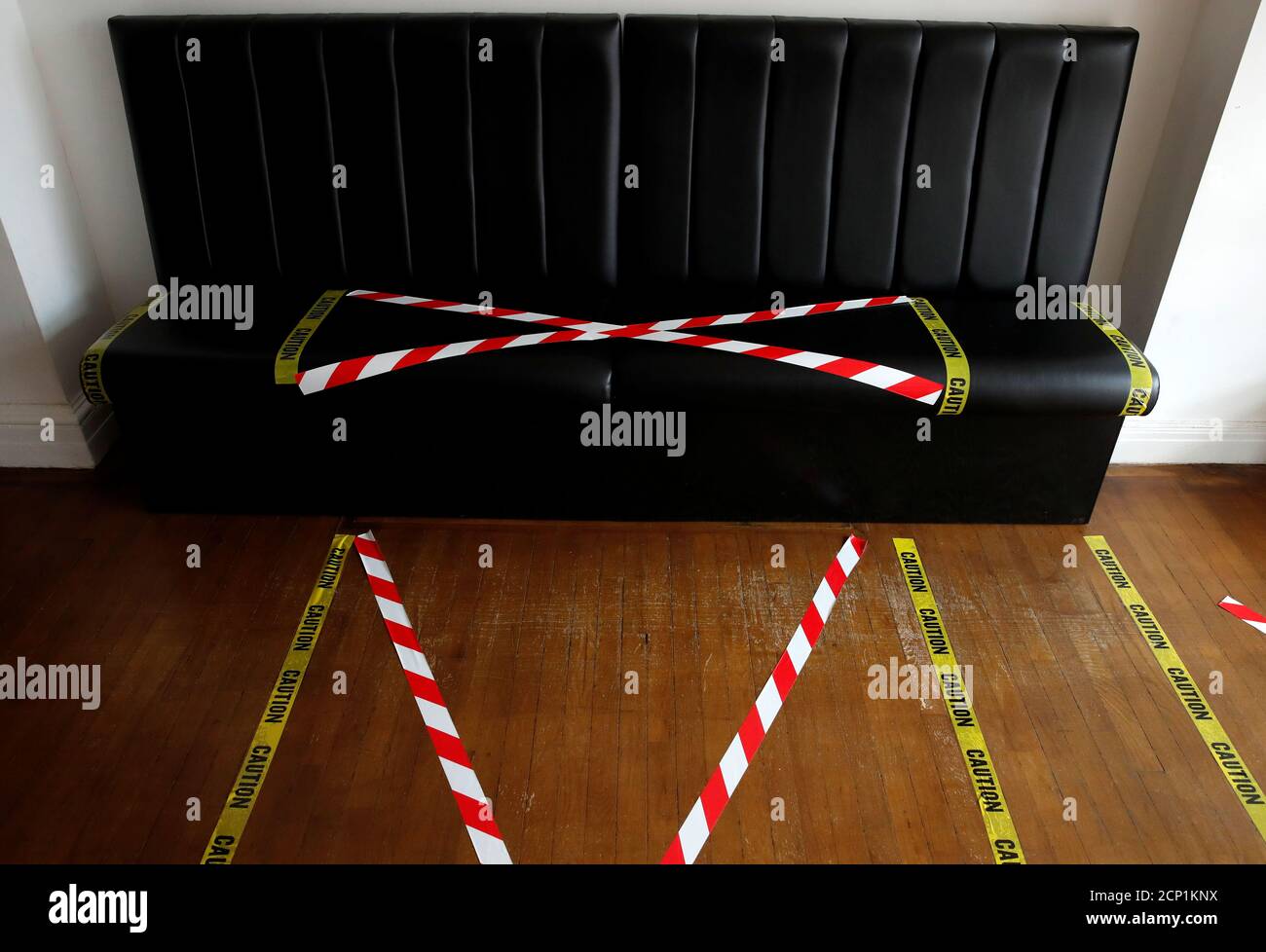 Social Distancing Markings Are Seen On The Couches And The Floor Of Stag Co Barber Shop