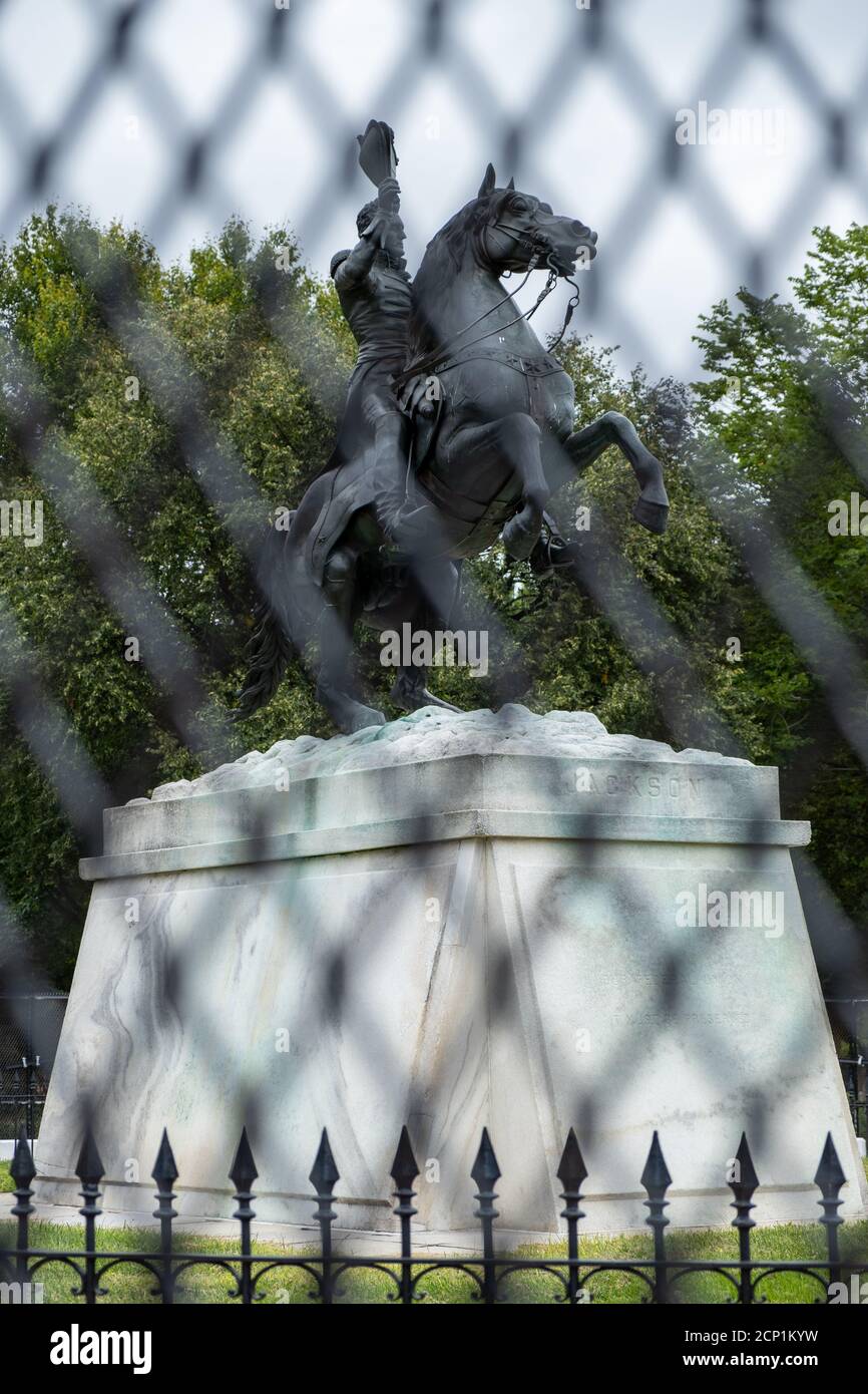 Statue of President Andrew Jackson behind a fence due to ongoing protests. Stock Photo