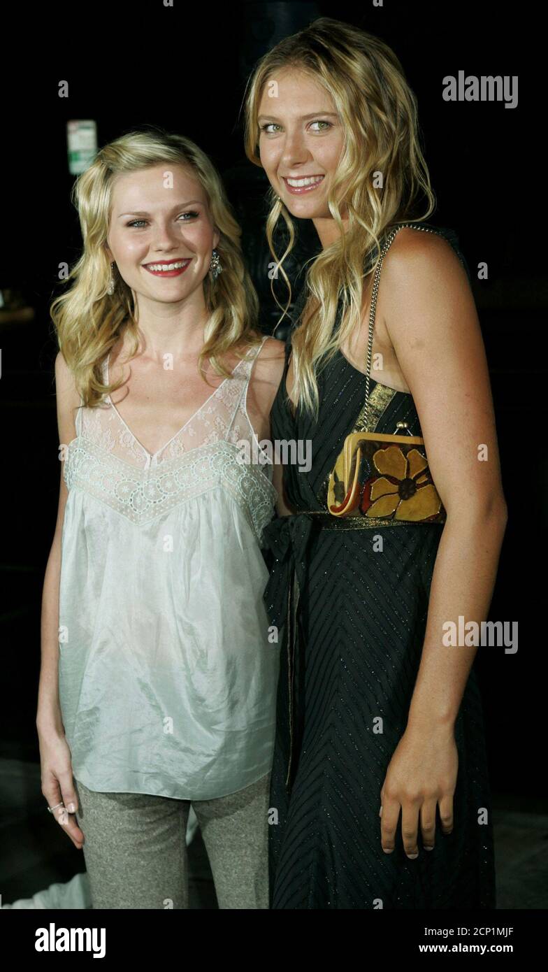 Actress Kirsten Dunst (L) poses with tennis player Maria Sharapova,the 2004  women's champion at Wimbledon, during the premiere of Dunst's new film  "Wimbledon" in Beverly Hills September 13, 2004. The film, about