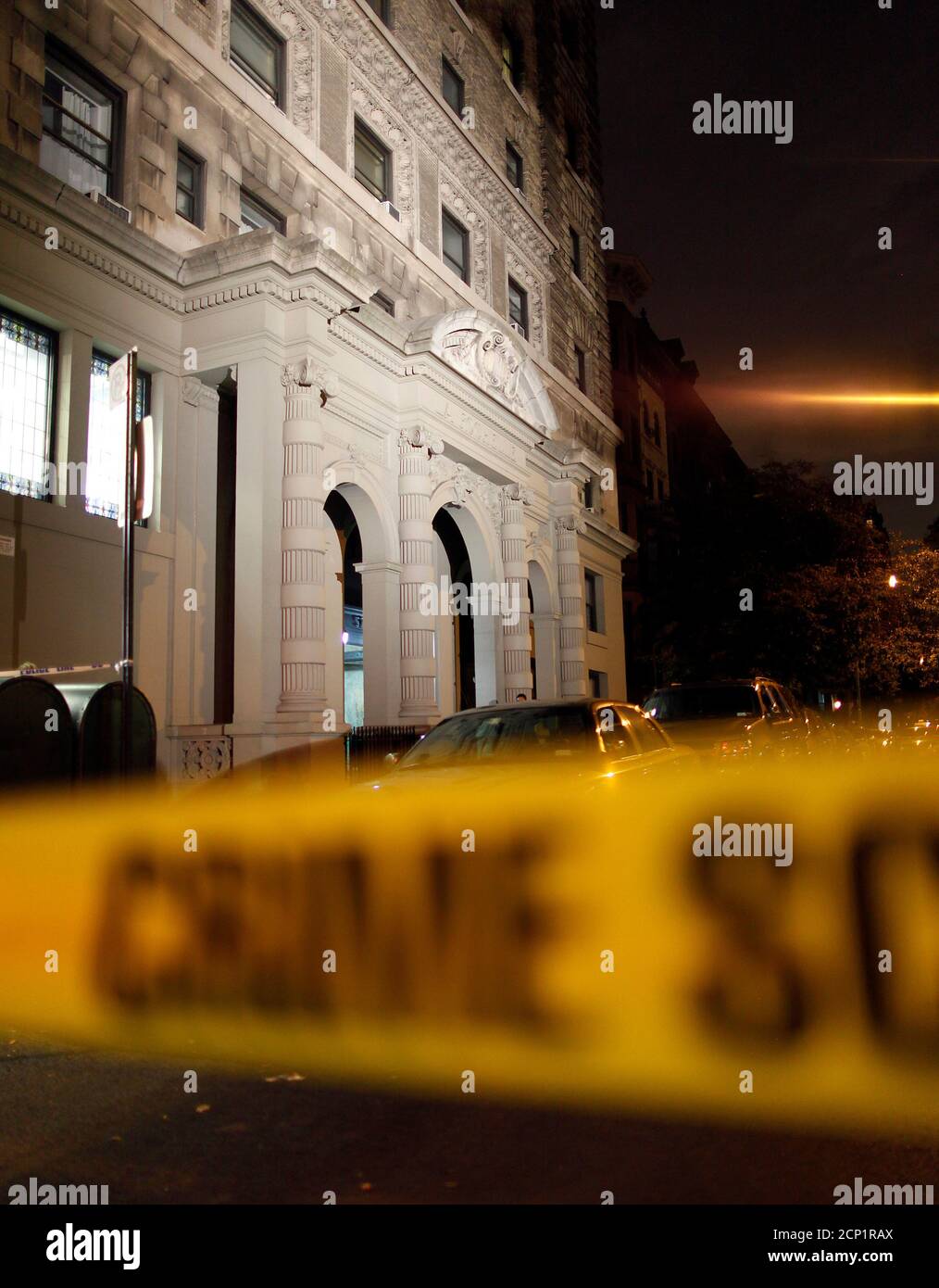 Crime scene tape surrounds a block on 57 West 75th Street in New York October 25, 2012. A mother returned home to her New York City apartment on this street on Thursday to find two of her young children, a boy and a girl, stabbed to death in the bathtub, and the family's nanny was arrested as the suspect in the killings, police said. The boy was believed to be 1 or 2 years old, and a girl about 6 years old, according to New York Police Department spokesman Paul Browne.       REUTERS/Carlo Allegri  (UNITED STATES - Tags: CRIME LAW SOCIETY) Stock Photo