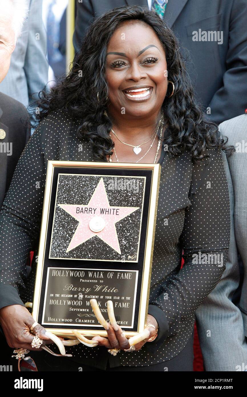 Glodean White, wife of the late singer Barry White, poses with a  commemorative plaque during ceremonies unveiling Barry White's star on the  Hollywood Walk of Fame in Hollywood, California September 12, 2013.