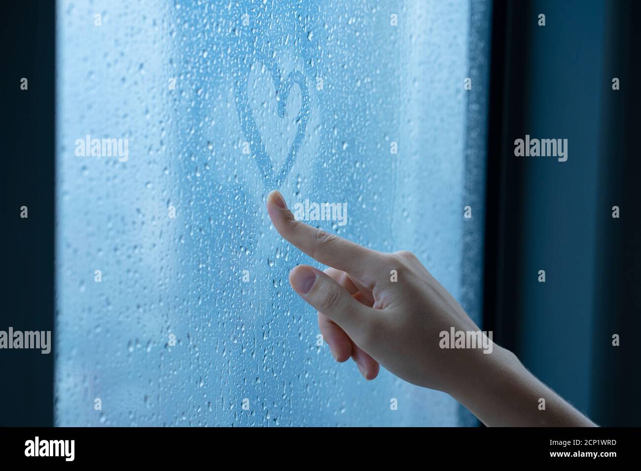 Female Hand Drawings A Heart On A Foggy Window During The Rain Glass In Drops Of Water The Concept Of Romance Stock Photo Alamy Female Hand Drawings A Heart On A Foggy Window During The Rain Glass In Drops Of Water The Concept Of Romance Stock Photo Alamy