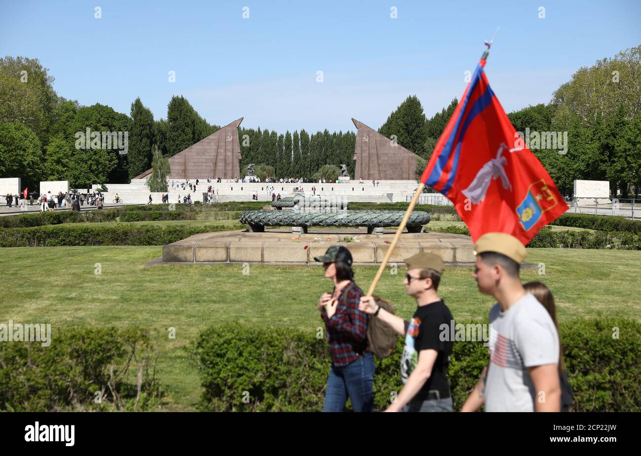 People gather at the Soviet War Memorial at Treptower Park, to mark Victory Day and the 75th anniversary of the end of World War Two, in Berlin, Germany May 9, 2020. REUTERS/Christian Mang Stock Photo