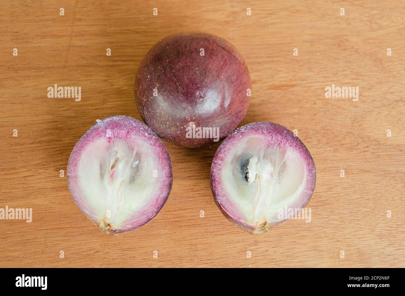 Ripe Whole Starapple And Cross Sections Stock Photo