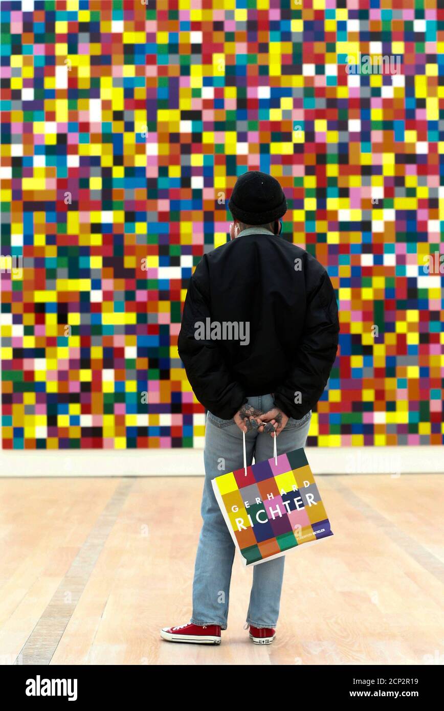 A man stands in front of the enamel on alu dibond '4900 Colors' from 2007  by German artist Gerhard Richter during a media preview of the exhibition  'Gerhard Richter' at the Fondation
