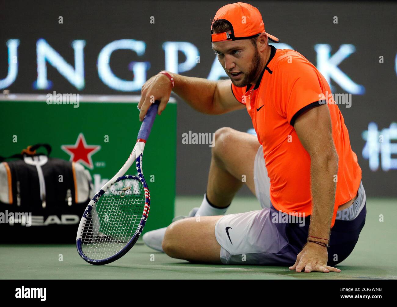 Tennis - Shanghai Masters tennis tournament - Shanghai, China - 14/10/16.  Jack Sock of U.S. falls during his match against Gilles Simon of France.  REUTERS/Aly Song Stock Photo - Alamy