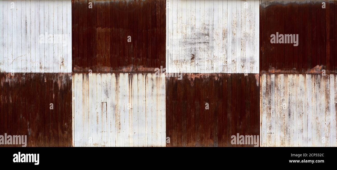 detail of a hangar door painted with a brown and white crescent shape Stock Photo