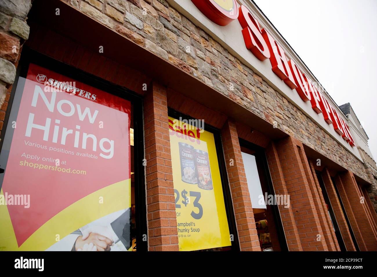 A now hiring sign is seen at the Shoppers supermarket in Olney, Maryland January 7, 2016. Shoppers supermarket is part of the SuperValu Inc network of stores.  Picture taken January 7, 2016.       REUTERS/Gary Cameron Stock Photo