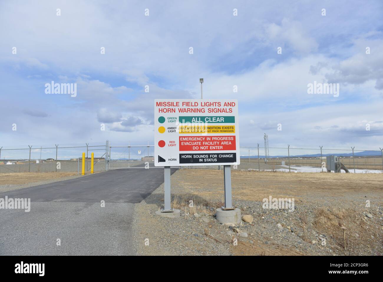 Sign describing warning system outside a field housing groundbased interceptor missiles at the