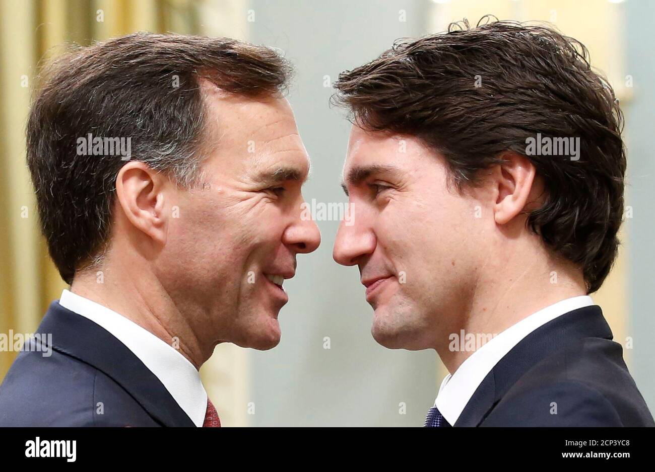 Canada's new Finance Minister Bill Morneau (L) is congratulated by Prime Minister Justin Trudeau at Rideau Hall in Ottawa November 4, 2015. Morneau's expertise on pension reform will likely also be a significant asset to the newly sworn in Liberal Prime Minister Justin Trudeau, who promised during the election campaign to work with the provinces and businesses to enhance the national pension plan.   REUTERS/Chris Wattie TPX IMAGES OF THE DAY Stock Photo