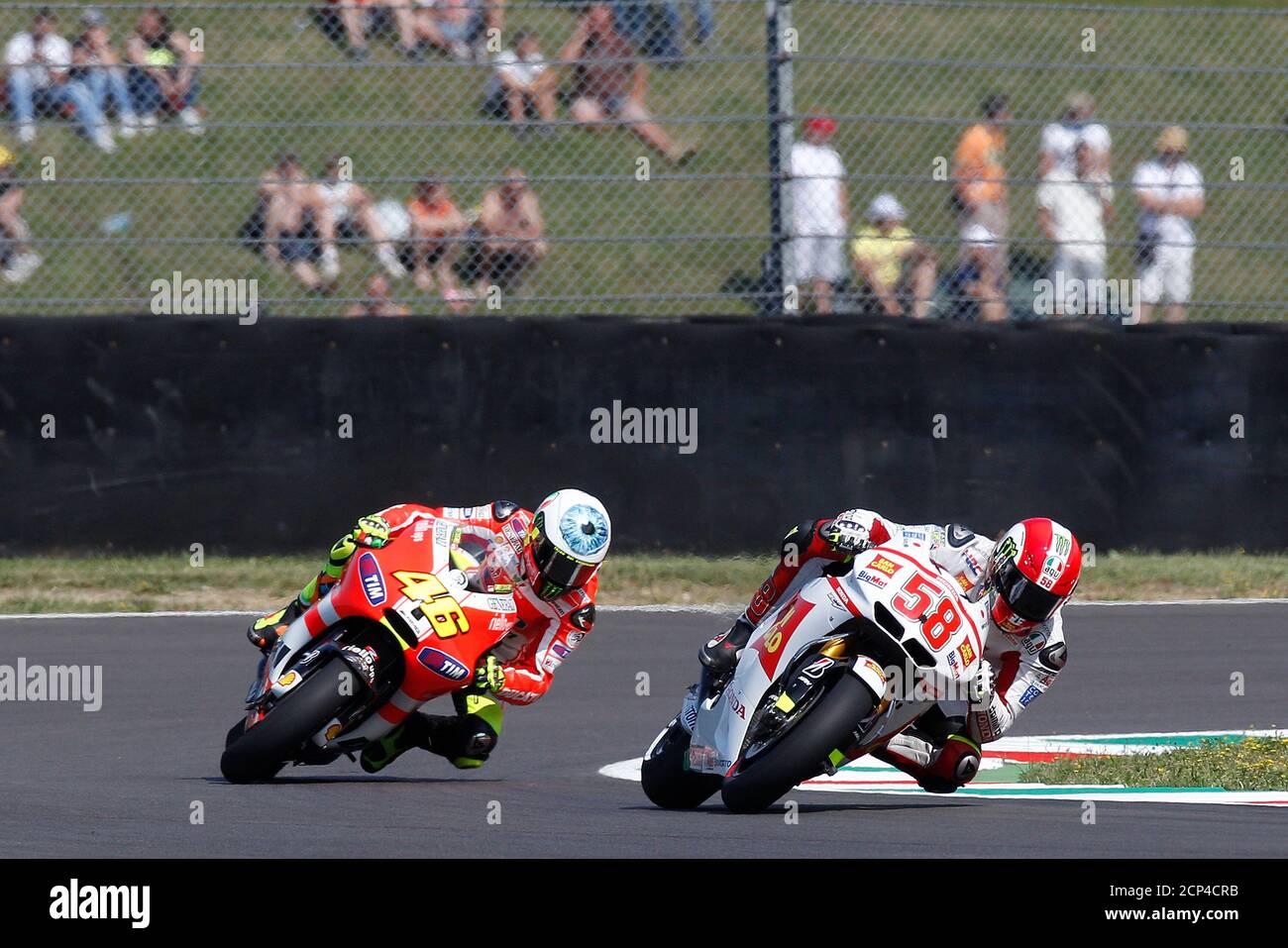 Honda MotoGP rider Marco Simoncelli (R) and Ducati rider Valentino Rossi of Italy  take a curve during the third practice session for the Italian motorcycling  Grand Prix at Mugello circuit July 2,