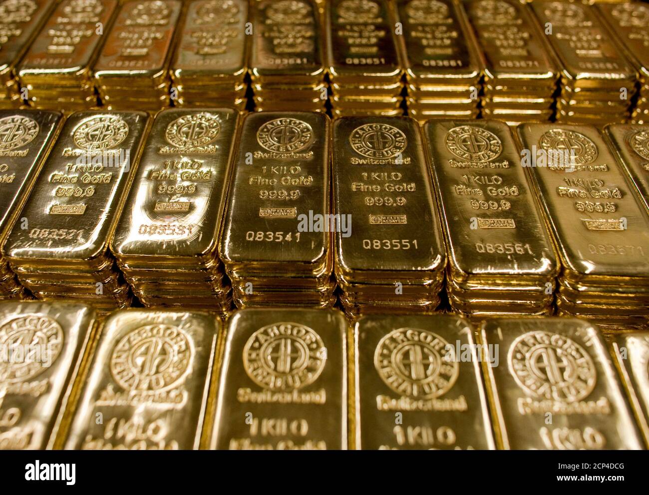 Gold bars of one kilogram are placed on a table at a plant of gold refiner  and bar manufacturer Argor-Heraeus SA in the southern Swiss town of  Mendrisio, March 1, 2012. REUTERS/Pascal
