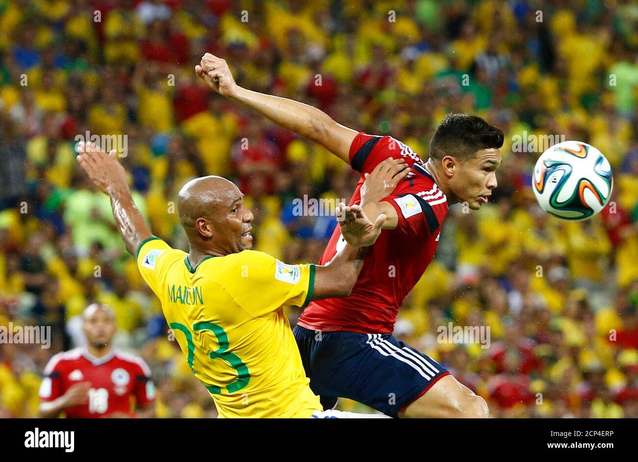 Brazil's Maicon jumps for the ball with Colombia's Teofilo Gutierrez during their 2014 World Cup quarter-finals at the Castelao arena in Fortaleza July 4, 2014. REUTERS/Stefano Rellandini (BRAZIL  - Tags: SOCCER SPORT WORLD CUP) Stock Photo