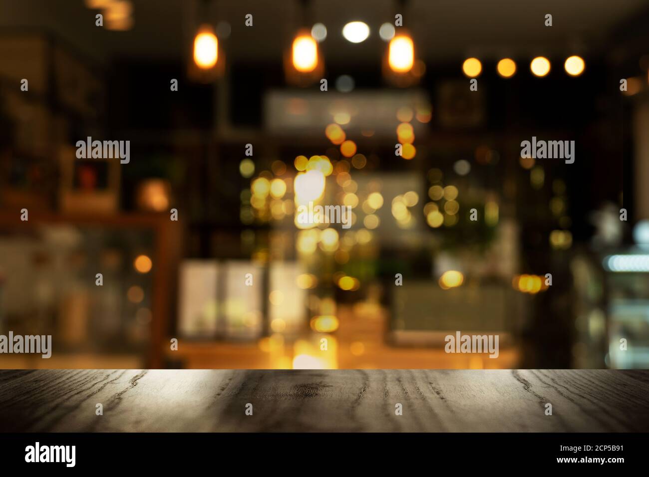 top of black table with blur light in cafe pub or bar party night life