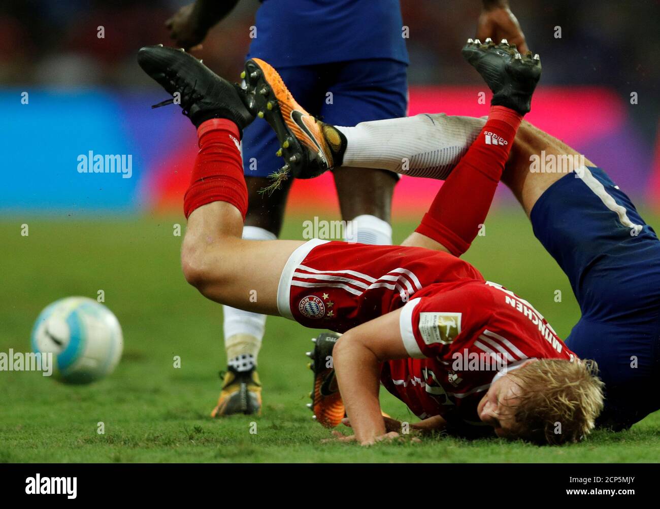 Football Soccer - Chelsea v Bayern Munich - International Champions Cup Singapore - National Stadium, Singapore - July 25, 2017 -  Bayern Munich's Felix Gotze falls after a tackle. REUTERS/Edgar Su Stock Photo