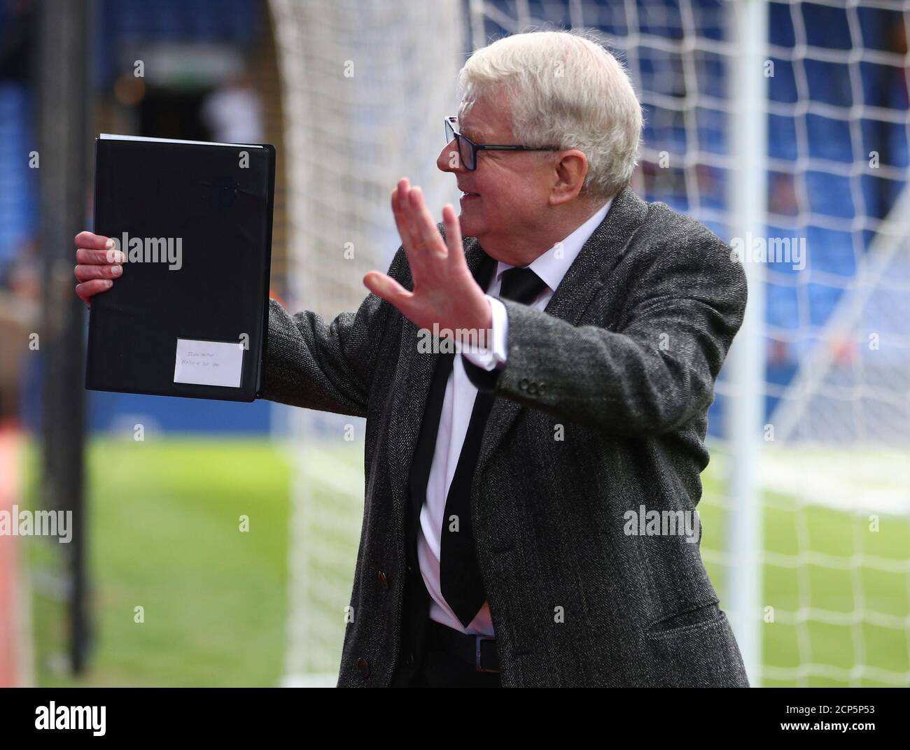 Soccer Football - Premier League - Crystal Palace vs West Bromwich Albion - Selhurst Park, London, Britain - May 13, 2018   Commentator John Motson waves to the fans before the match   REUTERS/Hannah McKay    EDITORIAL USE ONLY. No use with unauthorized audio, video, data, fixture lists, club/league logos or 'live' services. Online in-match use limited to 75 images, no video emulation. No use in betting, games or single club/league/player publications.  Please contact your account representative for further details. Stock Photo