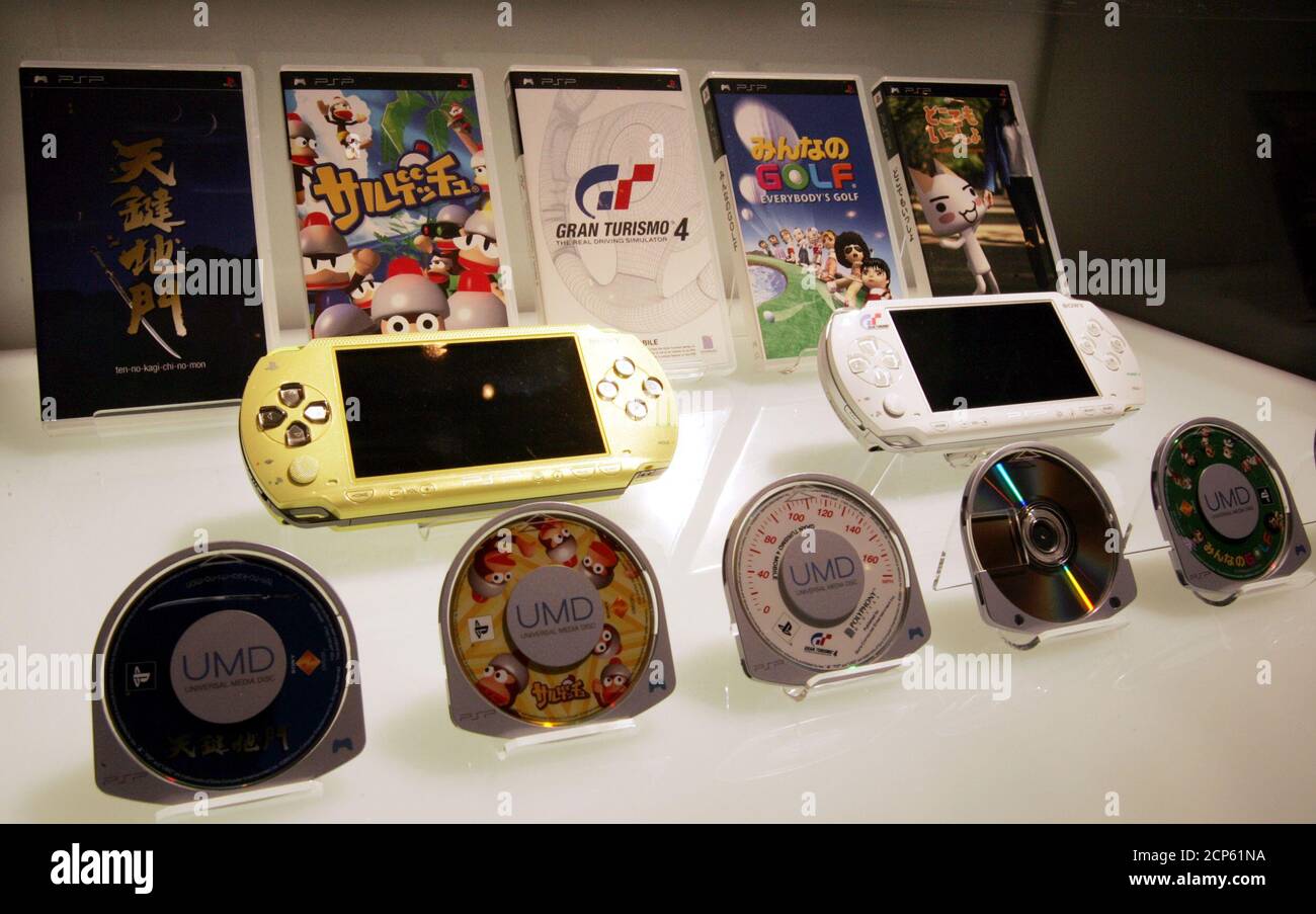 Sony Computer Entertainment unveils its new PlayStation Portable (PSP)  (centre row), its first handheld game console, displayed with its Universal  Media Discs in a glass showcase in Tokyo July 12, 2004. Sony