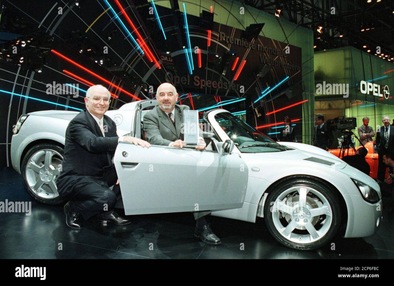 CHAIRMAN OF OPEL BOB HENDRY AND DIRECTOR OF OPEL SWITZERLAND ARMIN GROND  POSE WITH THE CABRIO OF THE YEAR. Chairman of Opel Bob Hendry (L) and  Director of Opel Switzerland Armin Grond (