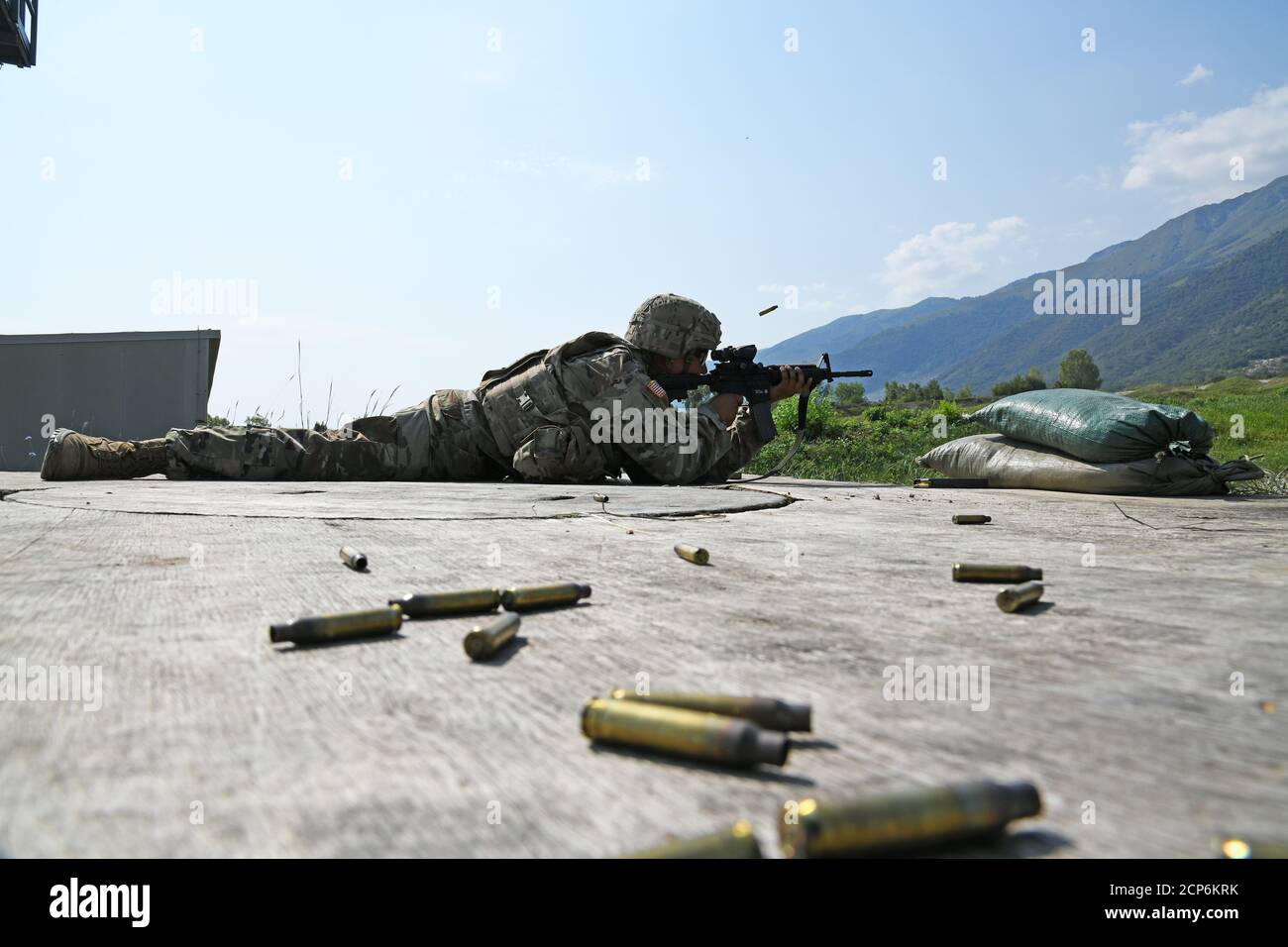 A U.S. Army Paratrooper assigned to 173rd Brigade Support Battalion, 173rd Airborne Brigade, fire with M4 carbine in the prone position during the marksmanship training under Covid-19 prevention condition at Cao Malnisio Range, Pordenone, Italy, Sept. 16, 2020. The 173rd Airborne Brigade is the U.S. Army Contingency Response Force in Europe, capable of projecting ready forces anywhere in the U.S. European, Africa or Central Commands' areas of responsibility.  (U.S. Army Photos by Paolo Bovo) Stock Photo