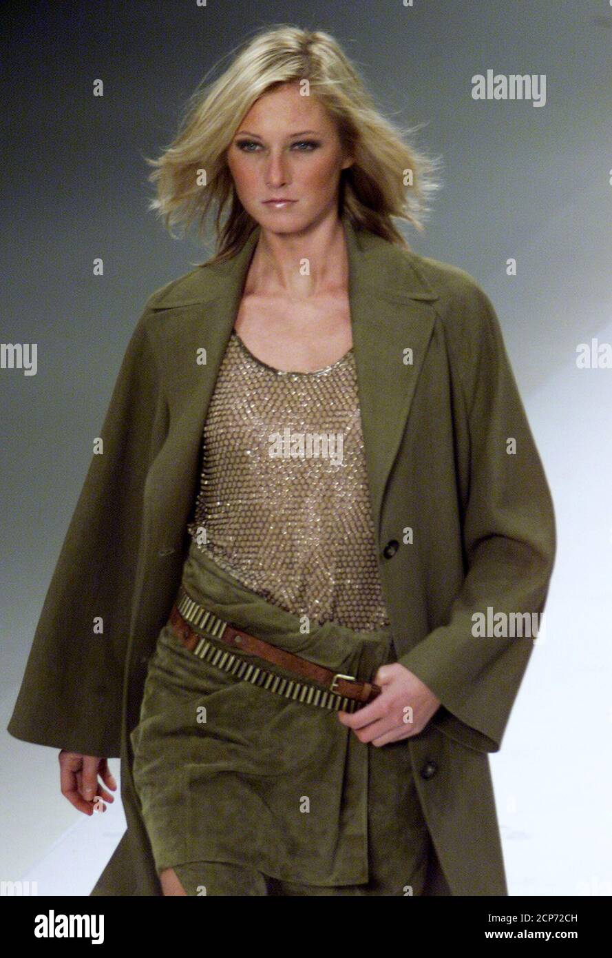 A model for French fashion house Celine wears a green jacket and skirt designed American Michael Kors as part of his Spring/Summer 2001 ready-to-wear collection October 10, 2000. The Paris ready-to