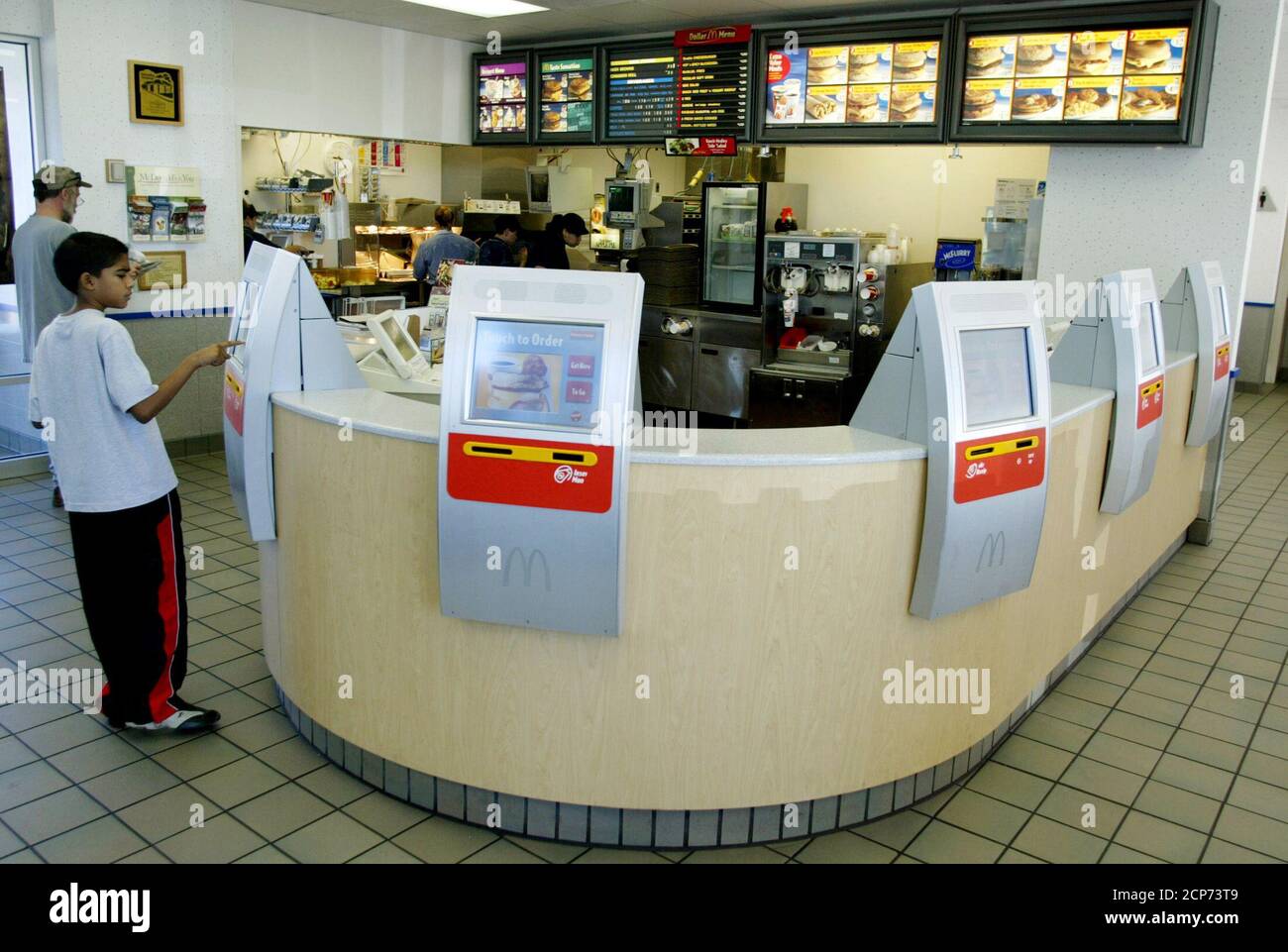 Computer terminals called kiosks line the counter at a McDonalds restaurant  in the Denver suburb of Littleton, Colorado July 10, 2003. The system which  uses touch screens for customers to make their