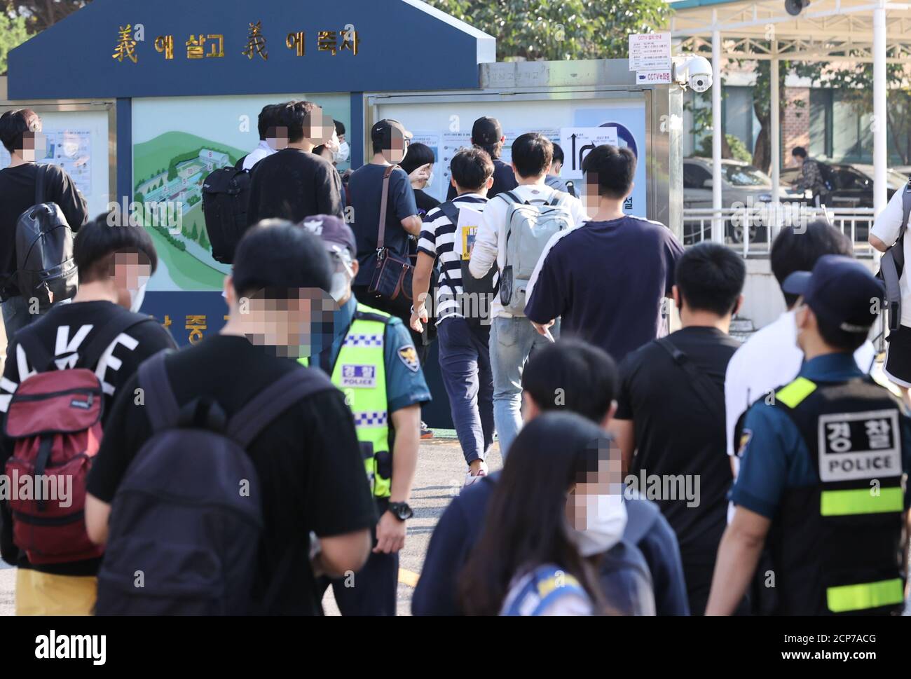 Seoul, South Korea. 19th Sep, 2020. Police recruitment test Applicants for the police recruitment exam enter the written test site at a school in Seoul on Sept. 19, 2020. Credit: Yonhap/Newcom/Alamy Live News Stock Photo
