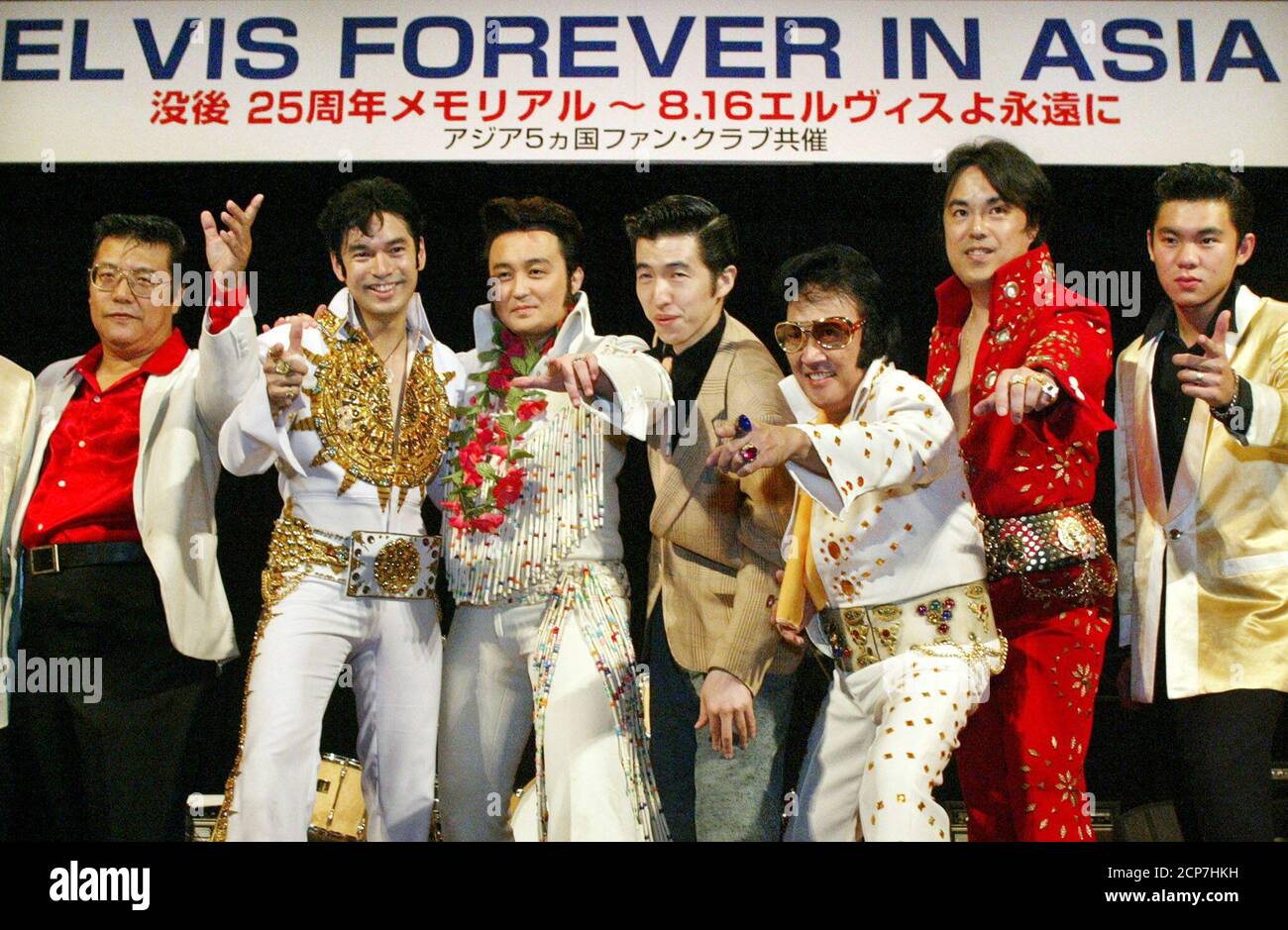 Elvis Presley impersonators from Japan, Hong Kong, the Philippines,  Thailand and Malaysia strike a pose as they perform at a fan club  convention in Tokyo August 17, 2002, in this combination photograph.