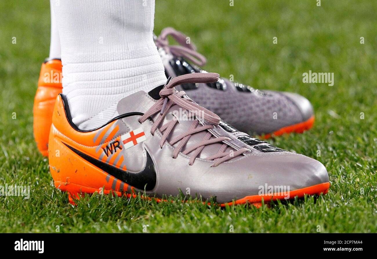 The boots of England's Wayne Rooney are seen during a 2010 World Cup Group  C soccer match against Algeria at Green Point stadium in Cape Town June 18,  2010. REUTERS/Darren Staples (SOUTH