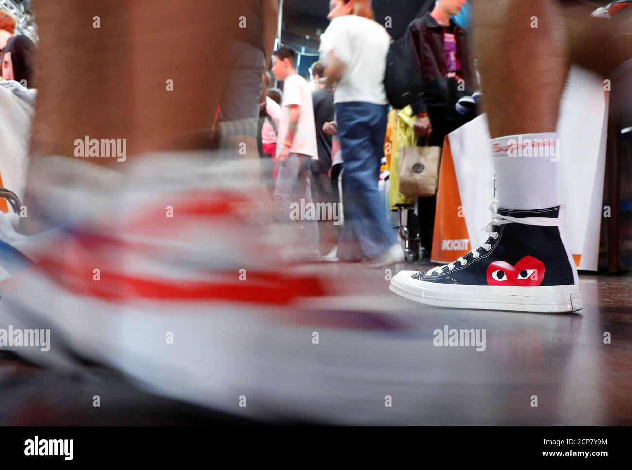 A man walks wearing a limited edition of Converse Chuck Taylor All Star Õ70  sneakers at the KICKIT Sneaker e Streetwear Market in Rome, Italy,  September 23, 2018. Picture taken September 23,