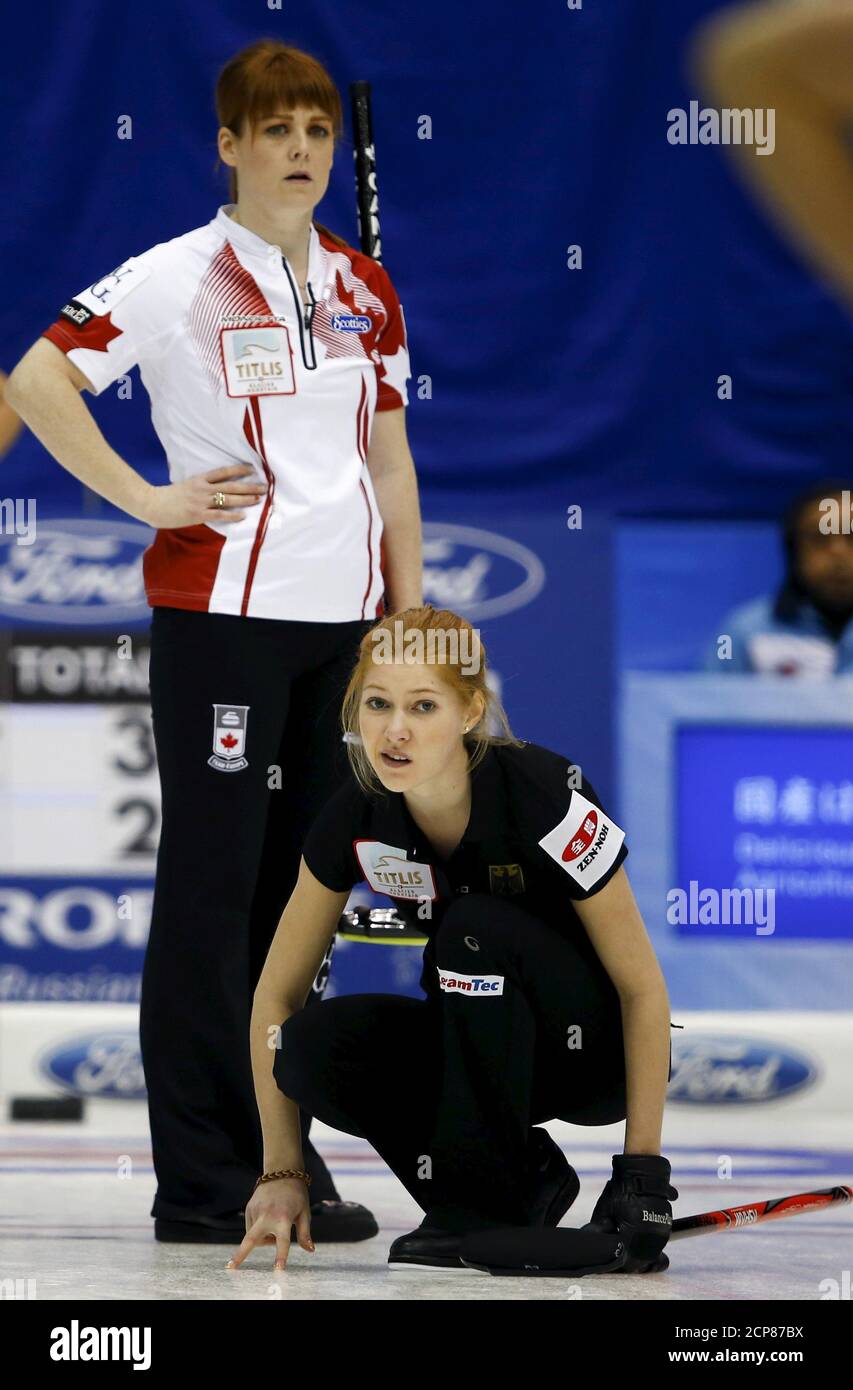 Germany's Stella Heiss (bottom) and Canada's Dawn McEwen watch Heiss' delivery during their round robin game at World Women's Curling Championships in Sapporo March 19, 2015.  REUTERS/Thomas Peter Stock Photo