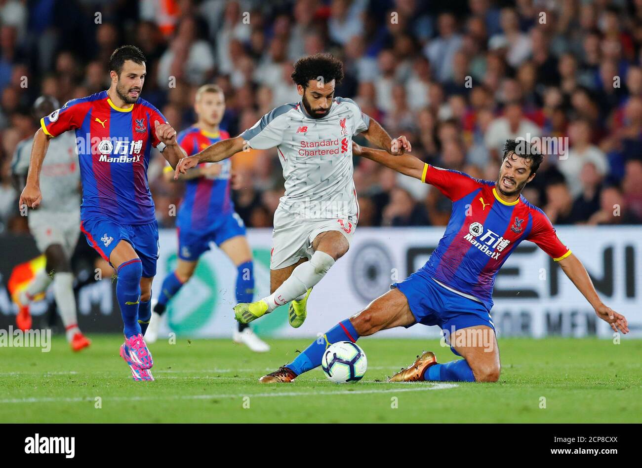 Soccer Football - Premier League - Crystal Palace v Liverpool - Selhurst Park, London, Britain - August 20, 2018 Liverpool's Mohamed Salah in action with Crystal Palace's James Tomkins and Luka Milivojevic REUTERS/Eddie Keogh EDITORIAL USE ONLY. No use with unauthorized audio, video, data, fixture lists, club/league logos or "live" services. Online in-match use limited to 75 images, no video emulation. No use in betting, games or single club/league/player publications. Please contact your account representative for further details. Stock Photo