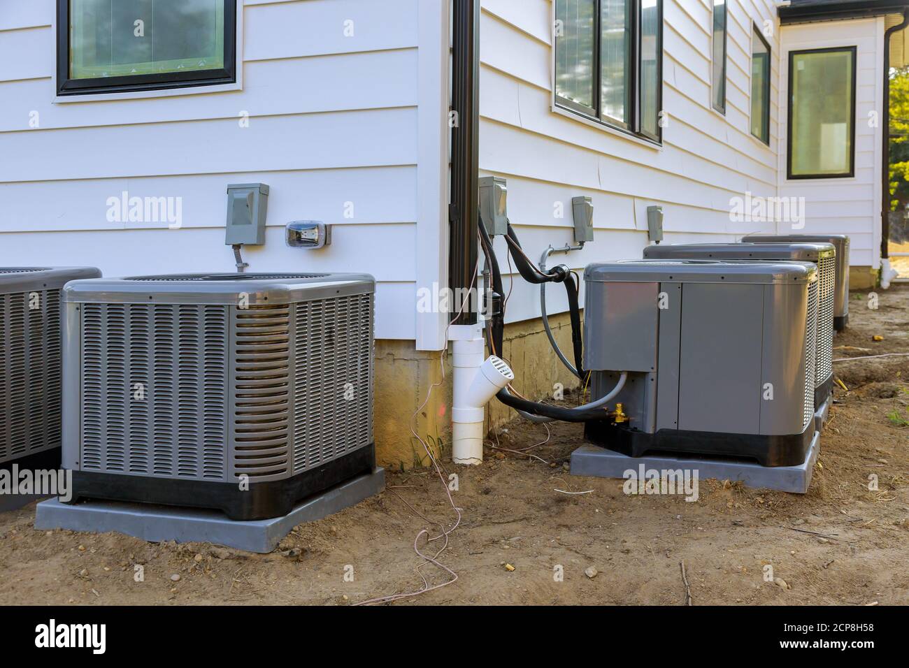 Air conditioning system unit installed outside facade of the new house  Stock Photo - Alamy