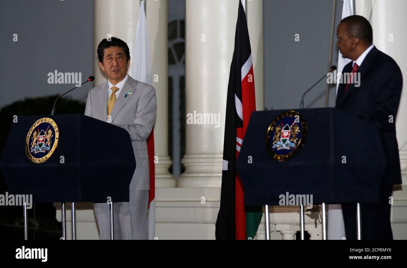 Japan's Prime Minister Shinzo Abe (L) flanked by Kenya's President Uhuru Kenyatta address news conference following bilateral talks at State House in Kenya's capital Nairobi, August 28, 2016. REUTERS/Thomas Mukoya? Stock Photo