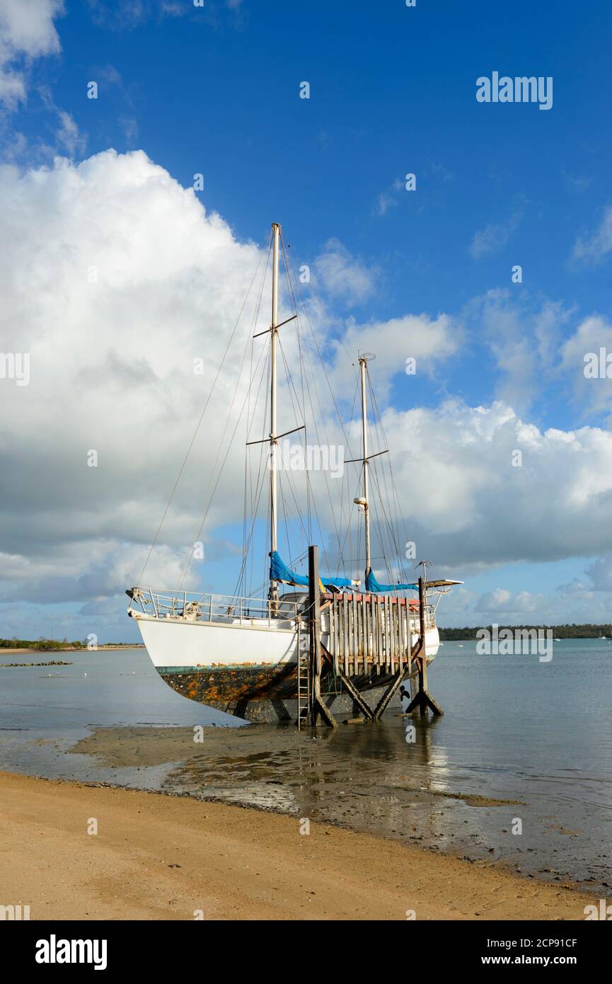 Sailing boat in dry dock at low tide outside the Boat Club, Nhulunbuy, East Arnhem Land, Northern Territory, NT, Australia Stock Photo