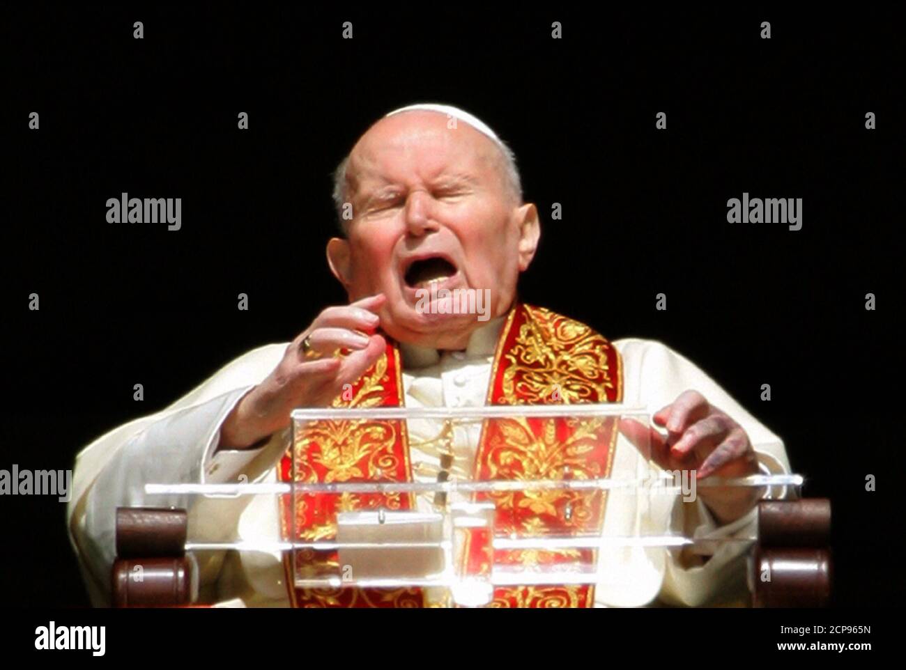 Pope John Paul II reacts as he appears from the window of his private  apartments at the Vatican March 27, 2005. An ailing Pope John Paul appeared  at his window to bless
