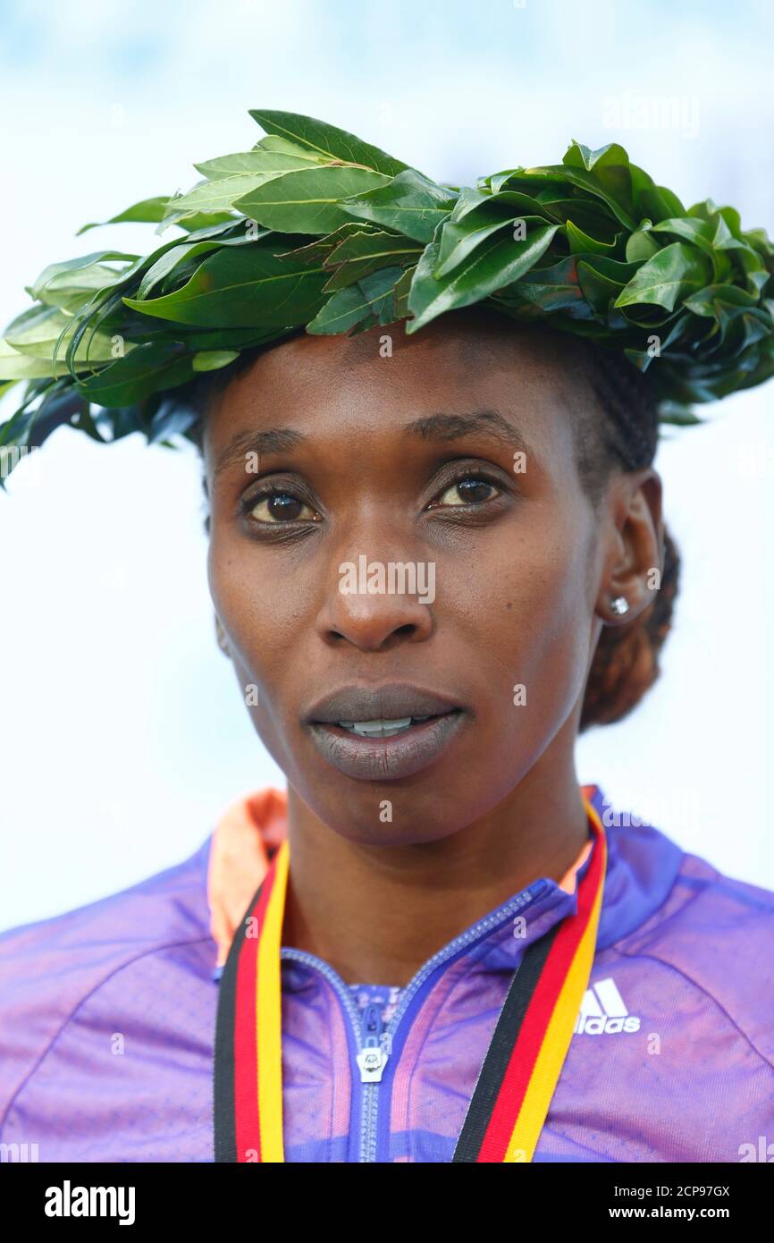 Kenya's Gladys Cherono reacts during the victory ceremony after winning the women's 42nd Berlin marathon, in Berlin, Germany September 27, 2015. Cherono time of two hours, nineteen minutes and twenty five seconds.  REUTERS/Hannibal Hanschke Stock Photo