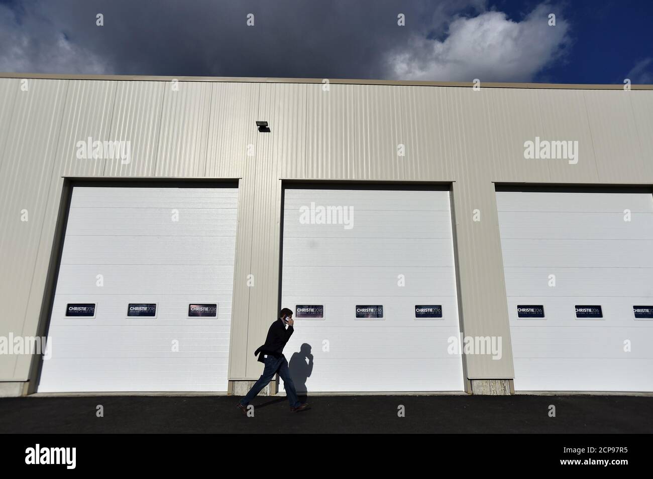 A campaign staffer walks past truck bays before U.S. Republican presidential candidate and New Jersey Governor Chris Christie's event to kick off a campaign bus tour in Exeter, New Hampshire December 19, 2015.      REUTERS/Gretchen Ertl Stock Photo
