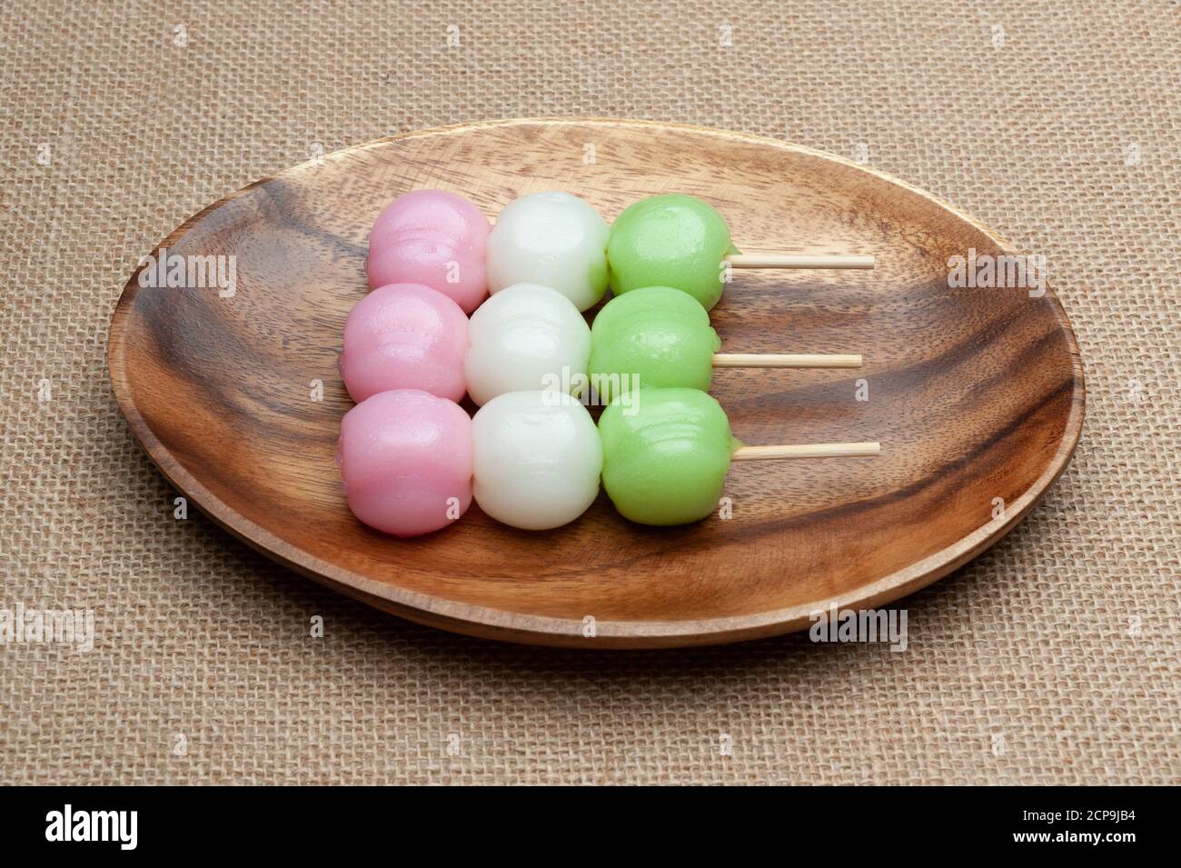 Japanese traditional sweet called Dango Mochi on wooden platter