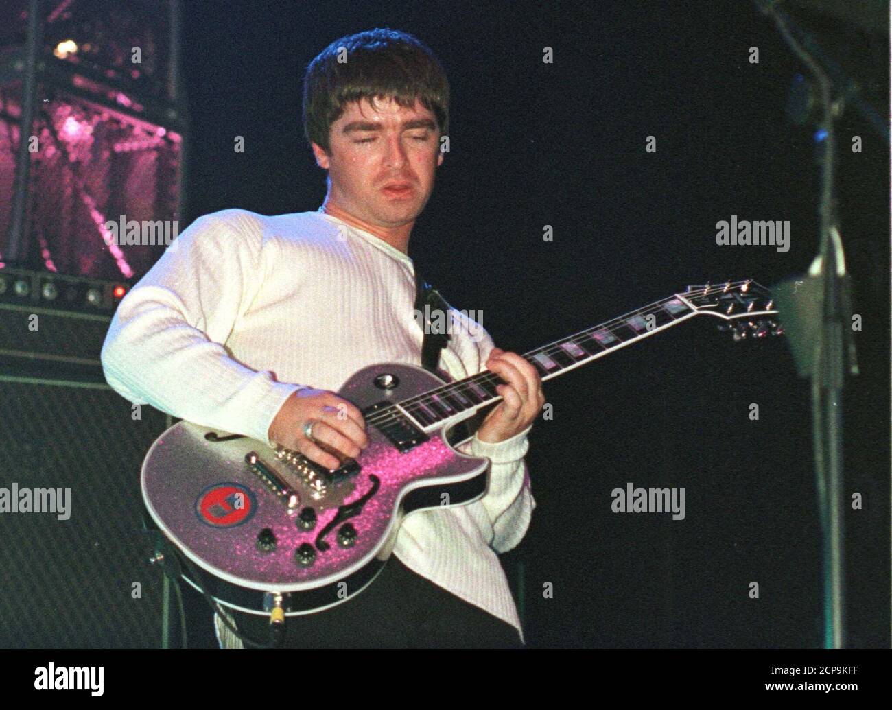 Noel Gallagher plays guitar during one of the opening songs on the first  night of the Oasis "Be Here Now Live 97" tour of Britain September 13.  Oasis's new record "Be here