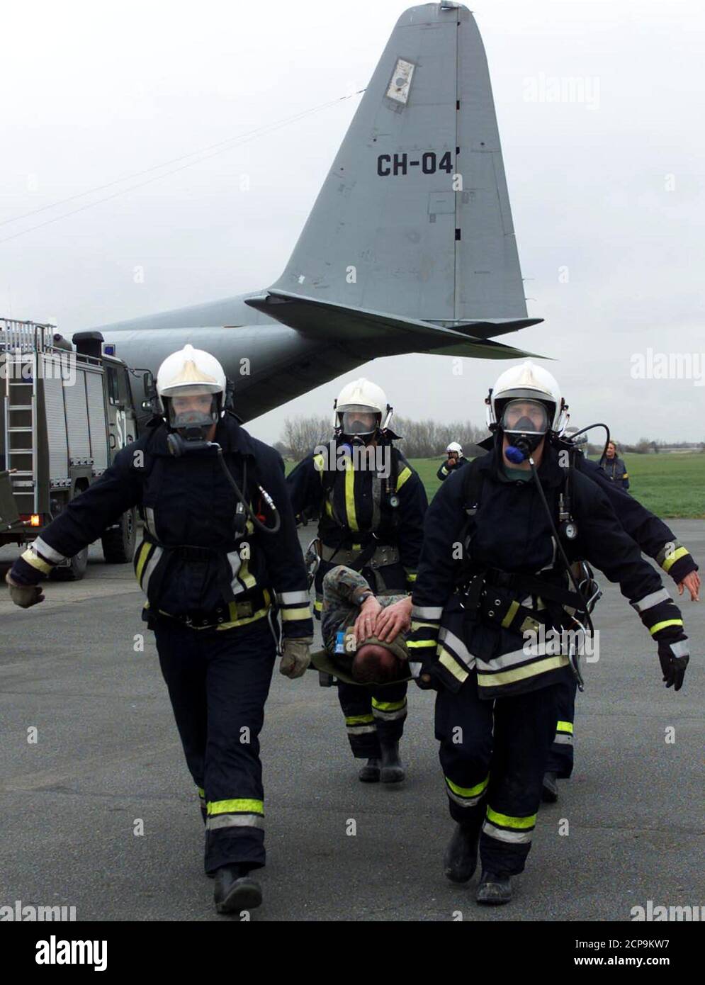 A volunteer playing the role of a victim is evacuated by firemen during the reconstruction of an emergency plan set up after an aeroplane crash in Koksijde, northern Belgium March 14. These exercises are frequently organised to prevent mistakes in the evacuation of victims.  HRM Stock Photo