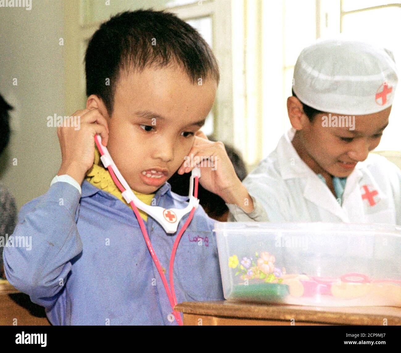 Ten Year Old Nguyen Van Luong L Who Suffers From Hydrocephaly Plays At A Centre For The Handicapped Near Hanoi March 5 02 Officials At The Centre Said The Children Were Born Handicapped Because Ten Year Old Nguyen Van Luong L Who Suffers From Hydrocephaly Plays At A Centre For The Handicapped Near Hanoi March 5 02 Officials At The Centre Said The Children Were Born Handicapped Because