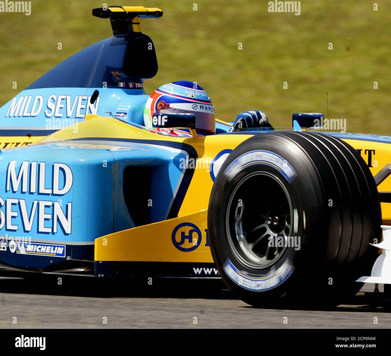 Italian Formula One driver Jarno Trulli takes a curve during the first  qualifying session for the Spanish Grand Prix at Montmelo's race track May  2, 2003. Trulli almost stole the five-times world