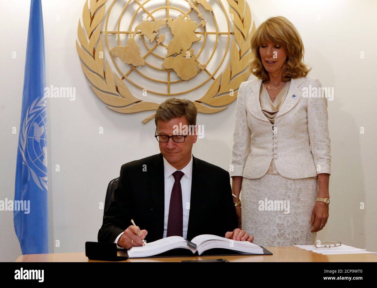 German Foreign Minister Guido Westerwelle signs the United Nations Arms Trade Treaty at the United Nations headquarters in New York, June 3, 2013. REUTERS/Brendan Mcdermid (UNITED STATES - Tags: POLITICS) Stock Photo