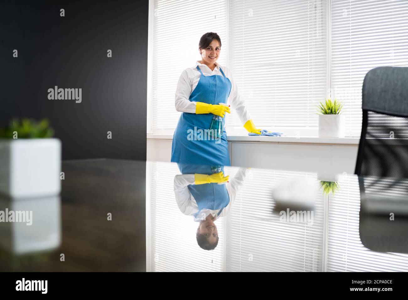 Professional House Cleaning Service. Room Cleaner And Housekeeper Stock Photo