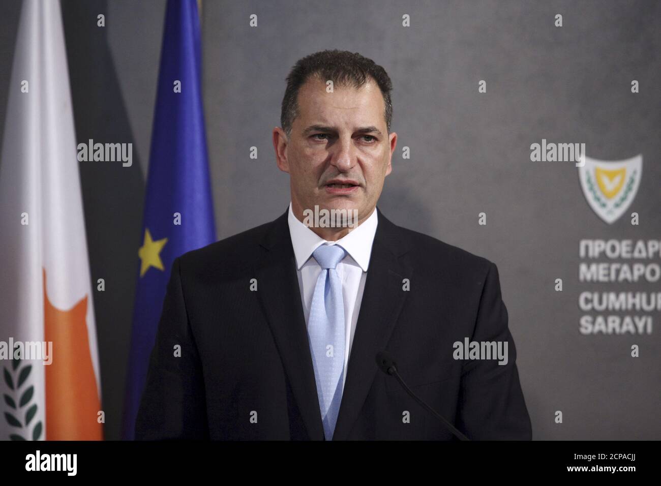Yiorgos Lakkotrypis, Cyprus' Minister of Energy, Commerce, Industry and Tourism, speaks during a news conference at the presidential palace in Nicosia, Cyprus November 23, 2015. Noble Energy has sought approval from the Cypriot government to include Britain's BG Group in a consortium holding rights over a natural gas field in the eastern Mediterranean, Cyprus's energy minister Lakkotrypis said on Monday. Lakkotrypis said Noble would remain administrator over the offshore field, known as 'Block 12', with it and BG Group holding 35 percent each and Israel's Delek Group holding 30 percent. The is Stock Photo