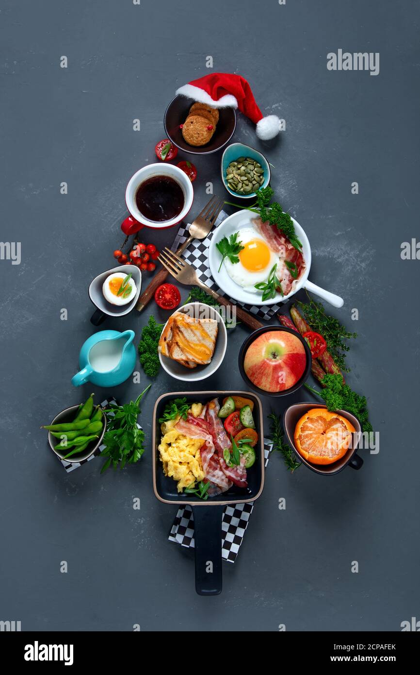 Christmas tree made of breakfast menu on grey background. Top view ...