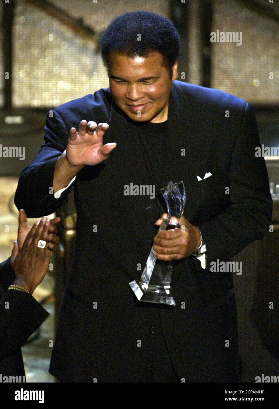 Boxing great Muhammad Ali waves after accepting the Humanitarian Award at the second annual Black Entertainment Television, BET Awards, June 25, 2002 at the Kodak Theatre in Hollywood. The awards show honors excellence by African American performers. REUTERS/Adrees Latif  AL/SV Stock Photo